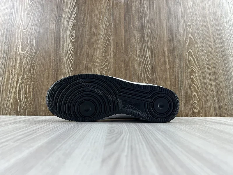 View 10 of Black Leather Low-Top Sneakers with Signature Swoosh