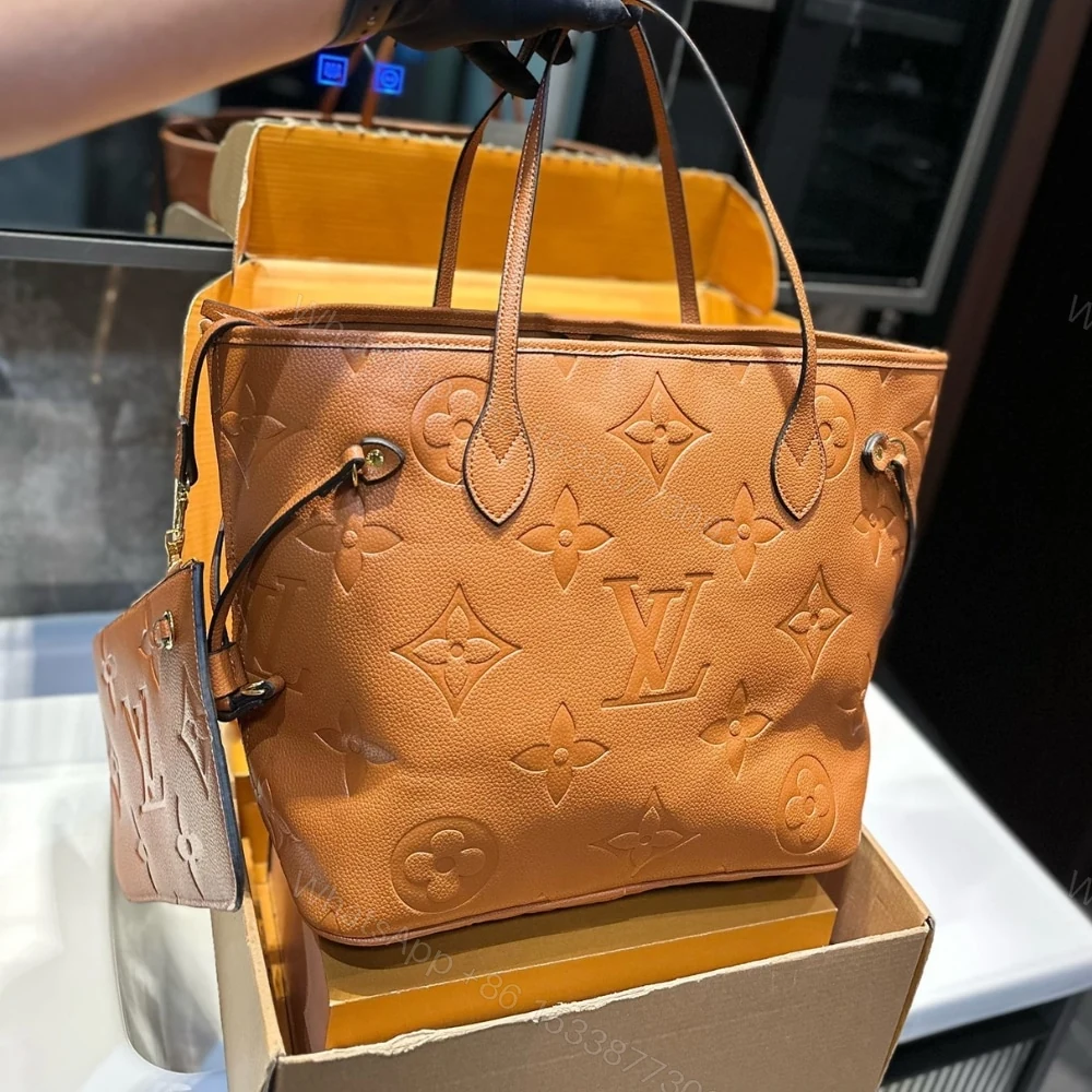 View 2 of Louis Vuitton Neverfull MM Monogram Empreinte Bag Cowhide Color 32Cm