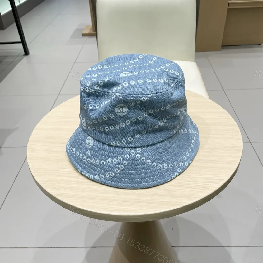 View 3 of Denim-Threaded Bucket Hat with Emblem: Bold, All-Season Style