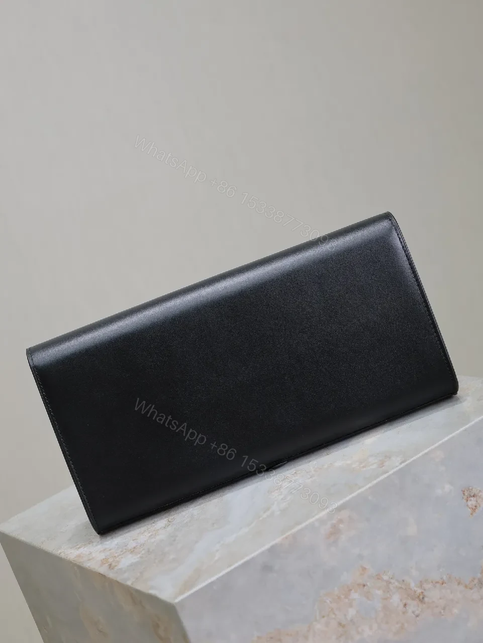 View 3 of Elegant Leather Clutch: Black, Gold Hardware, Minimalist Luxe
