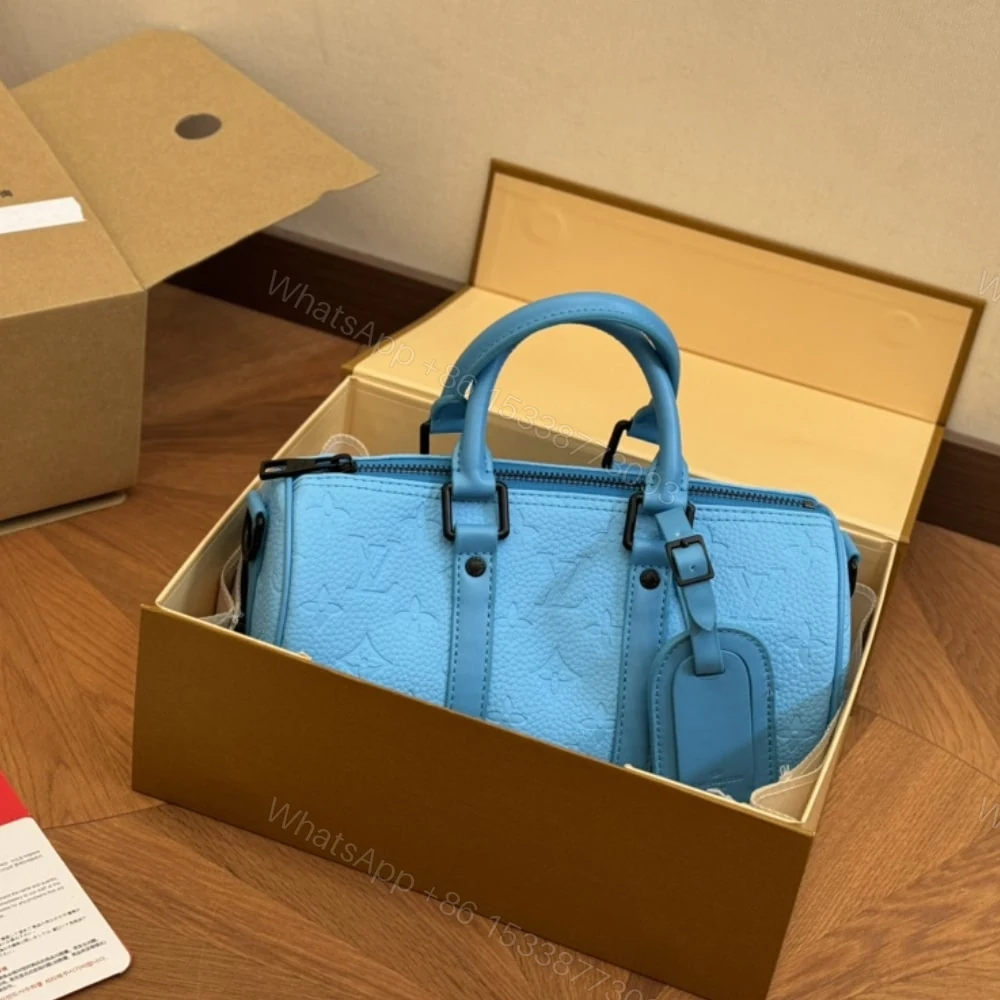 View 2 of Louis Vuitton Keepall Bandoulière 25 Turquoise 25Cm M11996