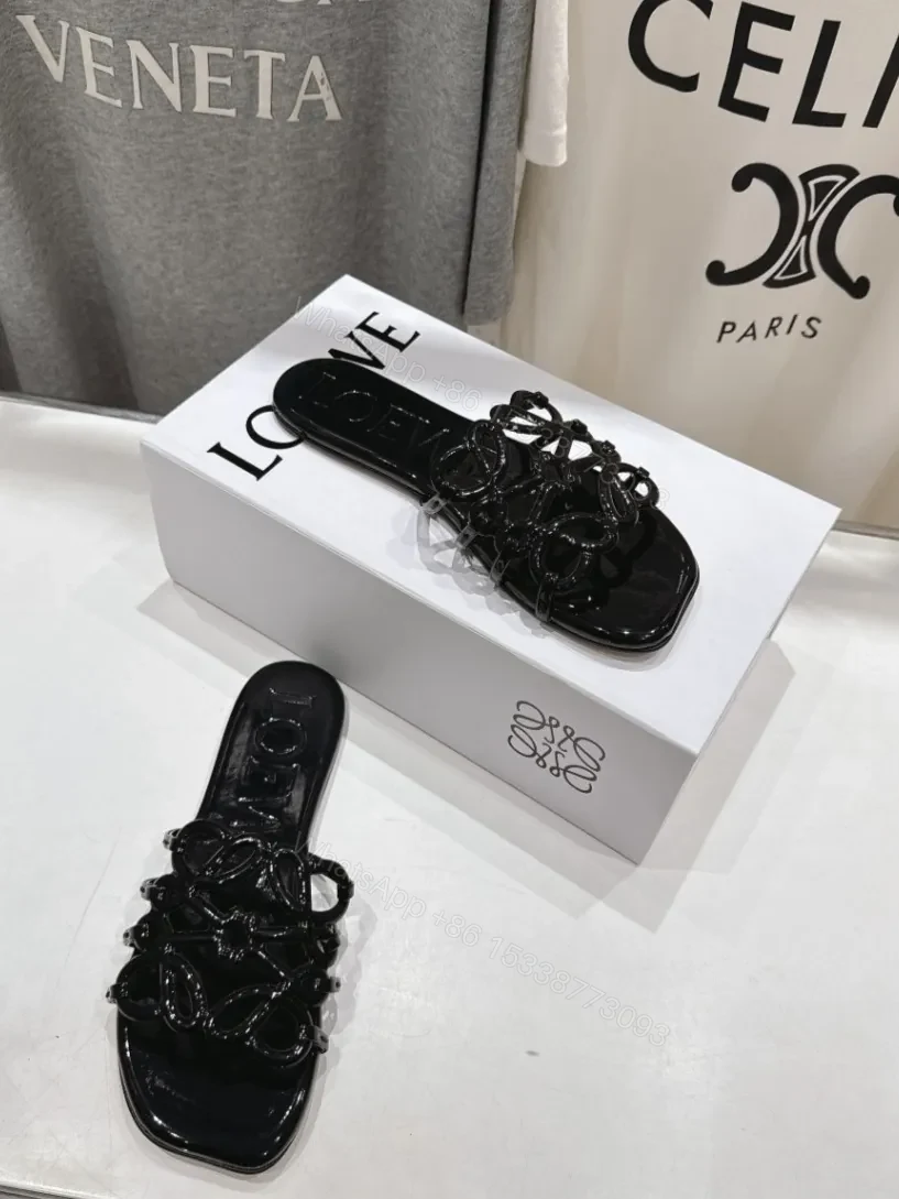 View 3 of Loewe Leather Petal Anagram Slides in Black