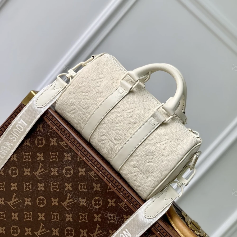 View 4 of Louis Vuitton Keepall Bandoulière 25 Bag Cream 25Cm M24434