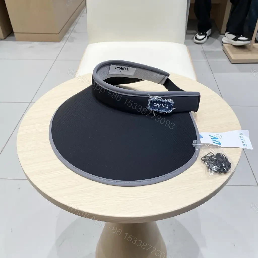 View 9 of Minimalist Black Visor with Chanel-Inspired Detail, UV Shield
