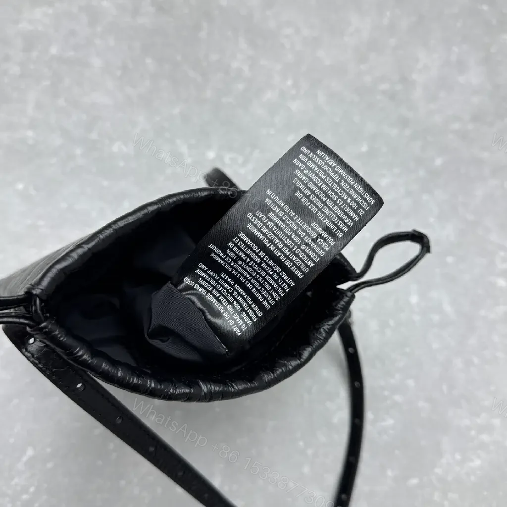 View 3 of Black Leather Drawstring Crossbody Bag - Minimalist Luxe Compact Carry