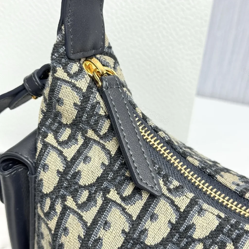 View 2 of Compact Monogram Canvas Bag with Leather Trim and Crossbody