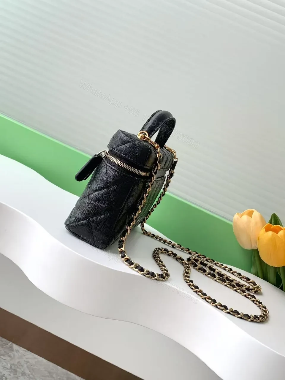 View 2 of Quilted Black Bag with Gold Hardware - Chic Compact Style