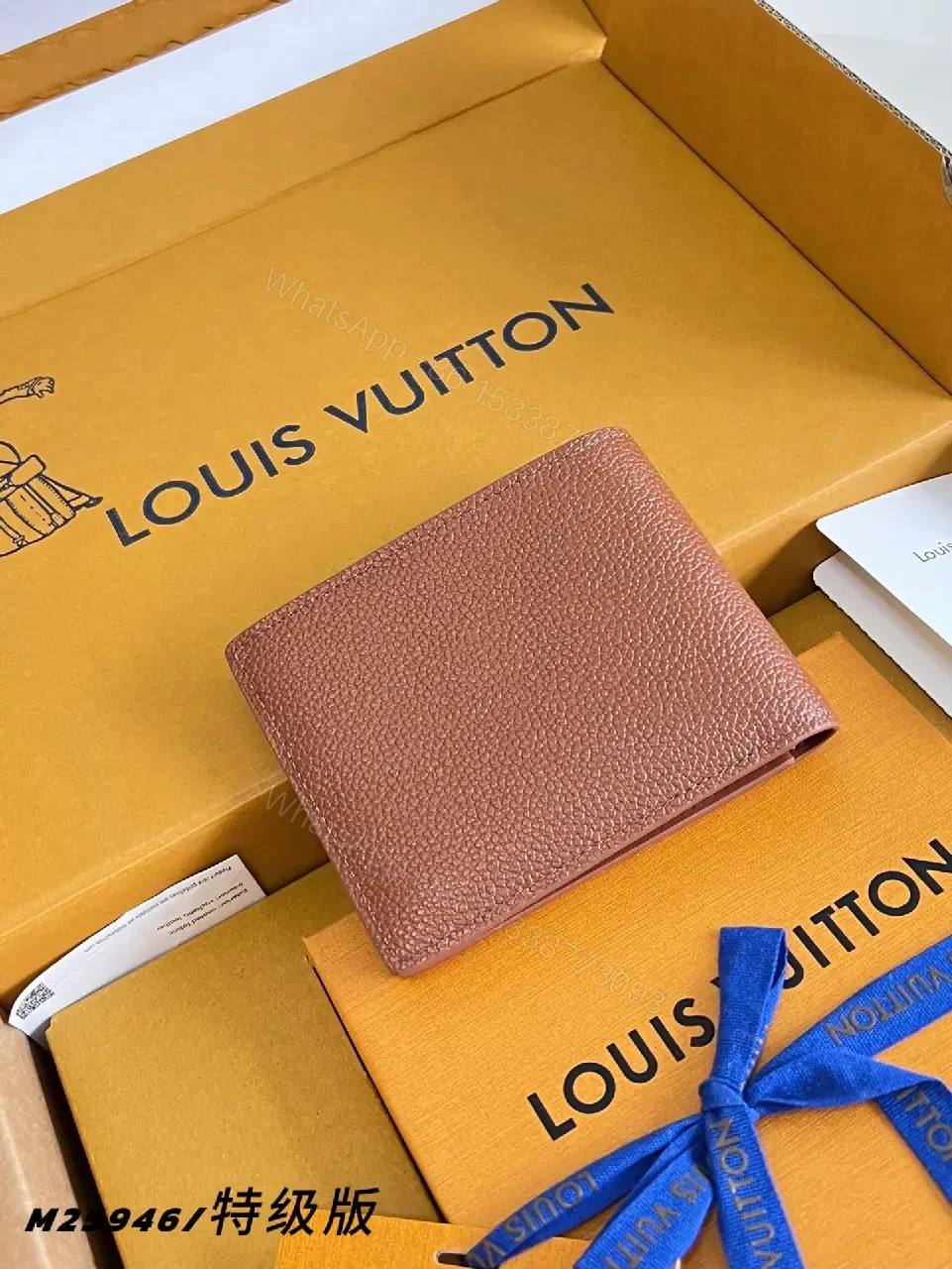 View 3 of Pink-Peach Pebbled Leather Bi-fold Wallet with LV Logo