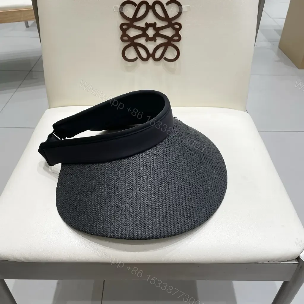 View 9 of Bold Sun Visor with LV Flair: Luxury-Casual Headwear
