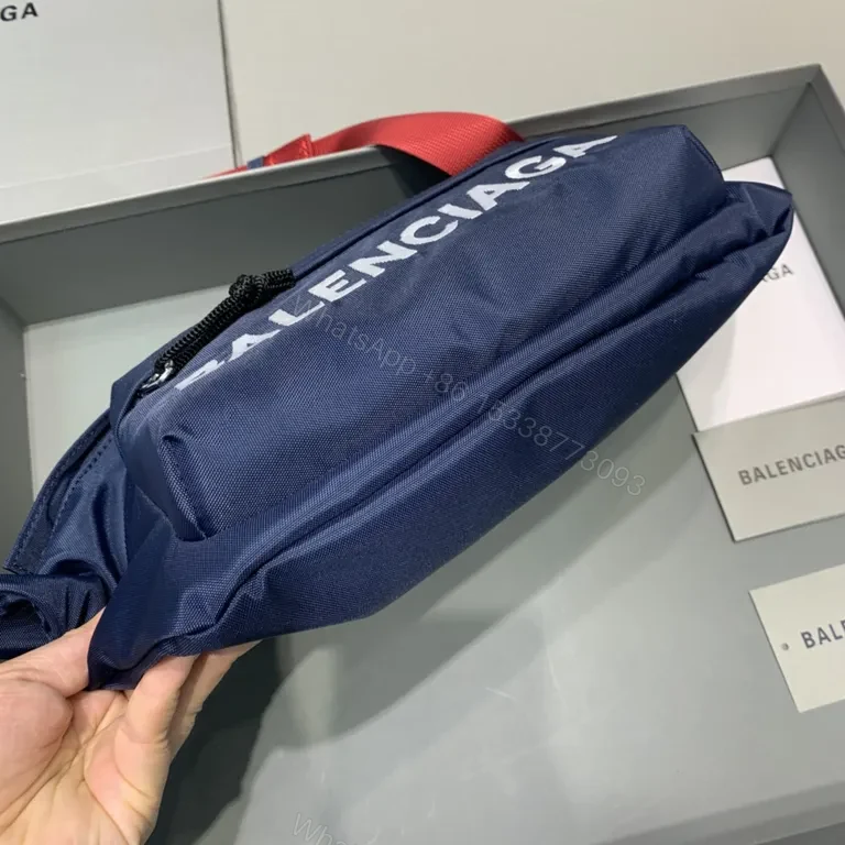 View 5 of Bold Navy Balenciaga Belt Bag with Red Strap - Hands-Free Luxury