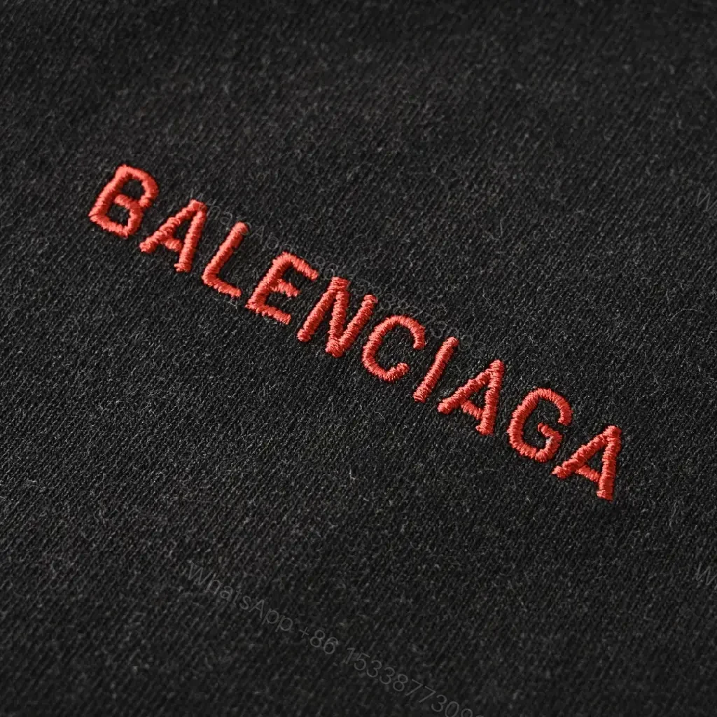 View 9 of Minimalist Black Cotton Tee with Subtle Red Embroidery