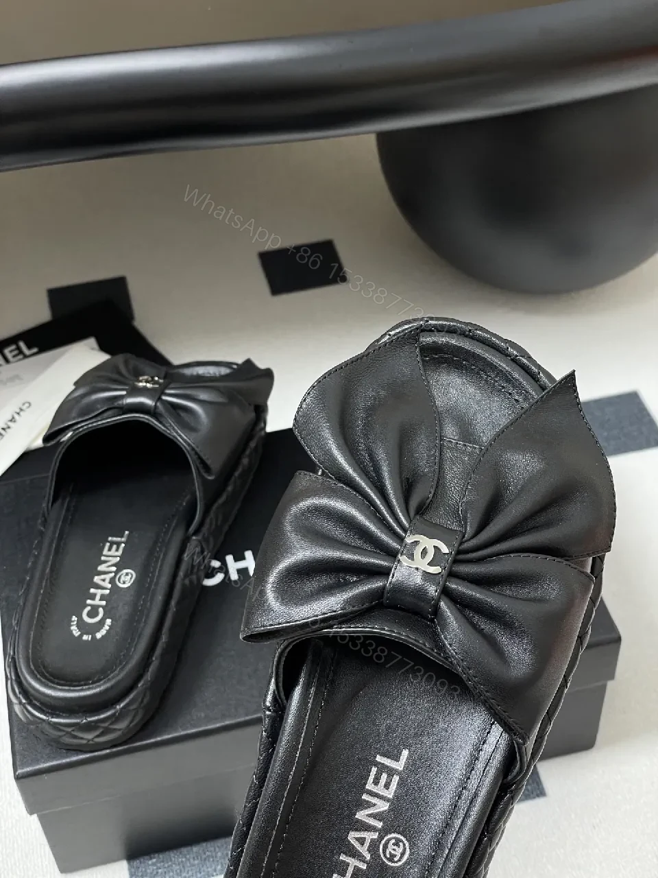 View 5 of Chic Black Quilted Slides with Bow Detail - Luxury Casual Platform