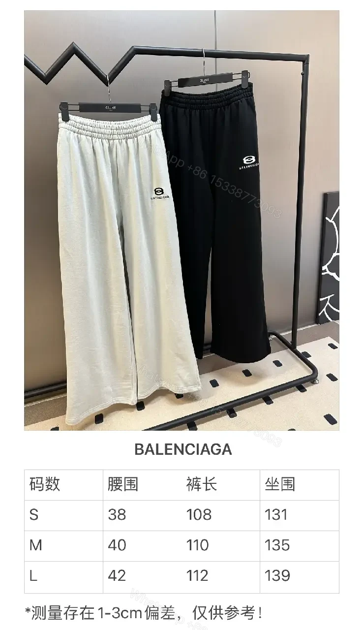 View 9 of Chic Black Wide-Leg Track Pants with Subtle Logo