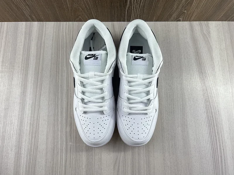 View 4 of Minimal White & Black Nike-Style Sneaker with Gum Sole