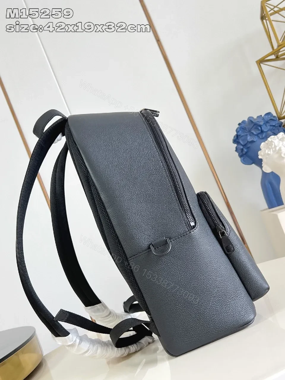 View 3 of Gray Leather Compact Backpack: Minimalist Luxury, Subtle Branding, Everyday Organizer