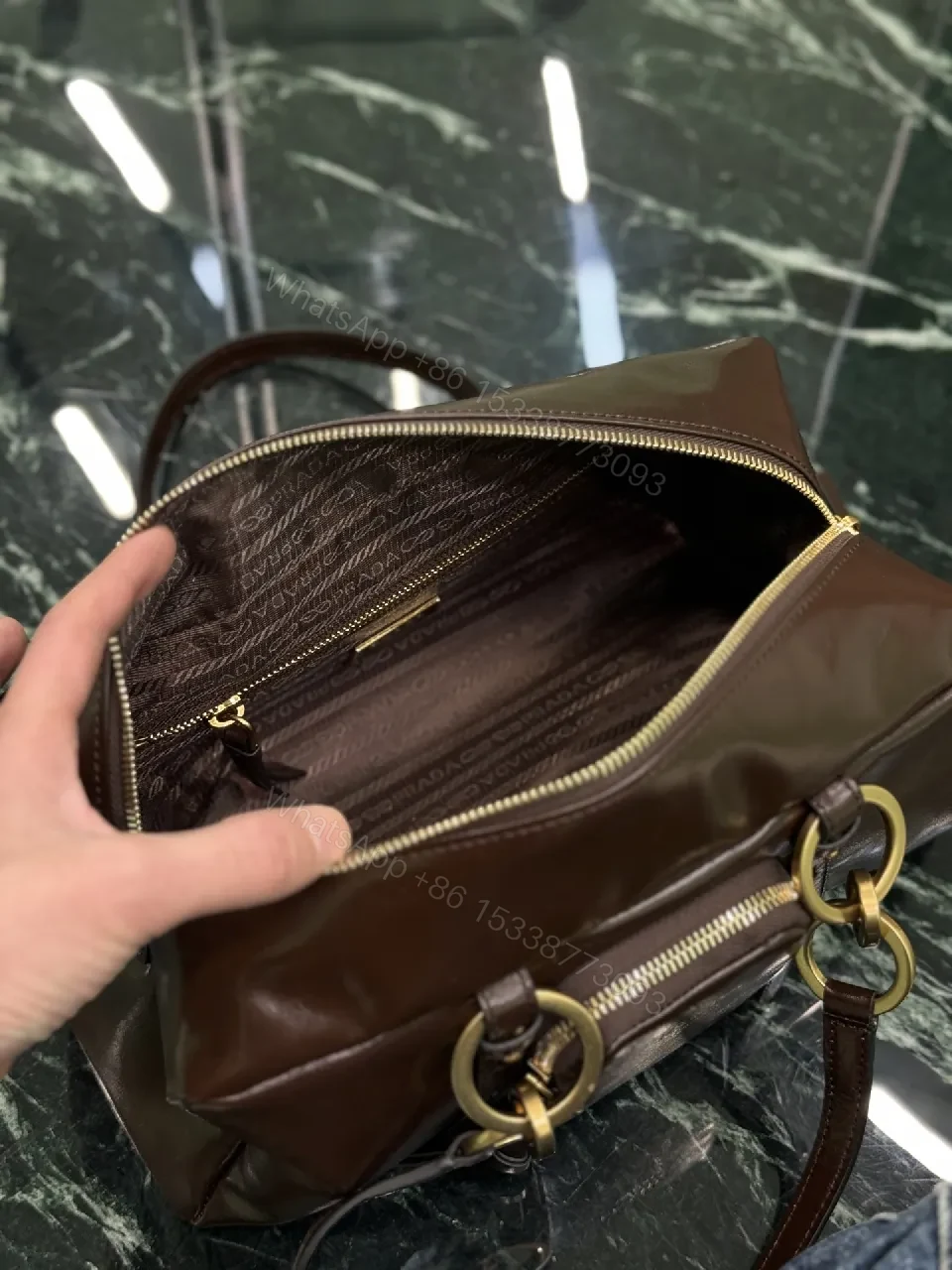View 5 of Chic Black Leather Handbag with Gold Hardware & Structure