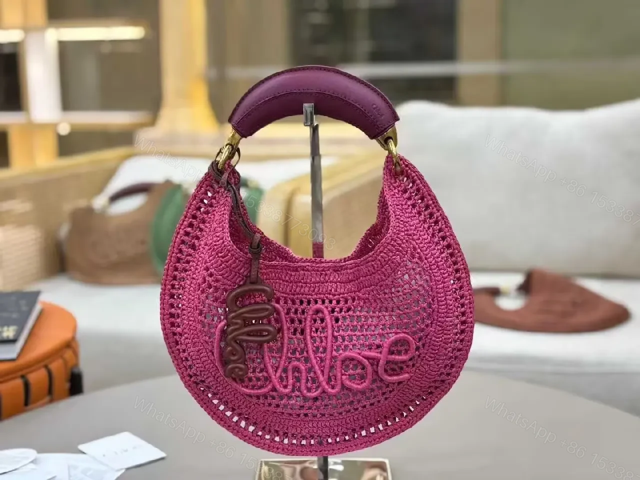 View 4 of Magenta Crochet Crescent Bag: Elegant, Compact, Textured Luxe