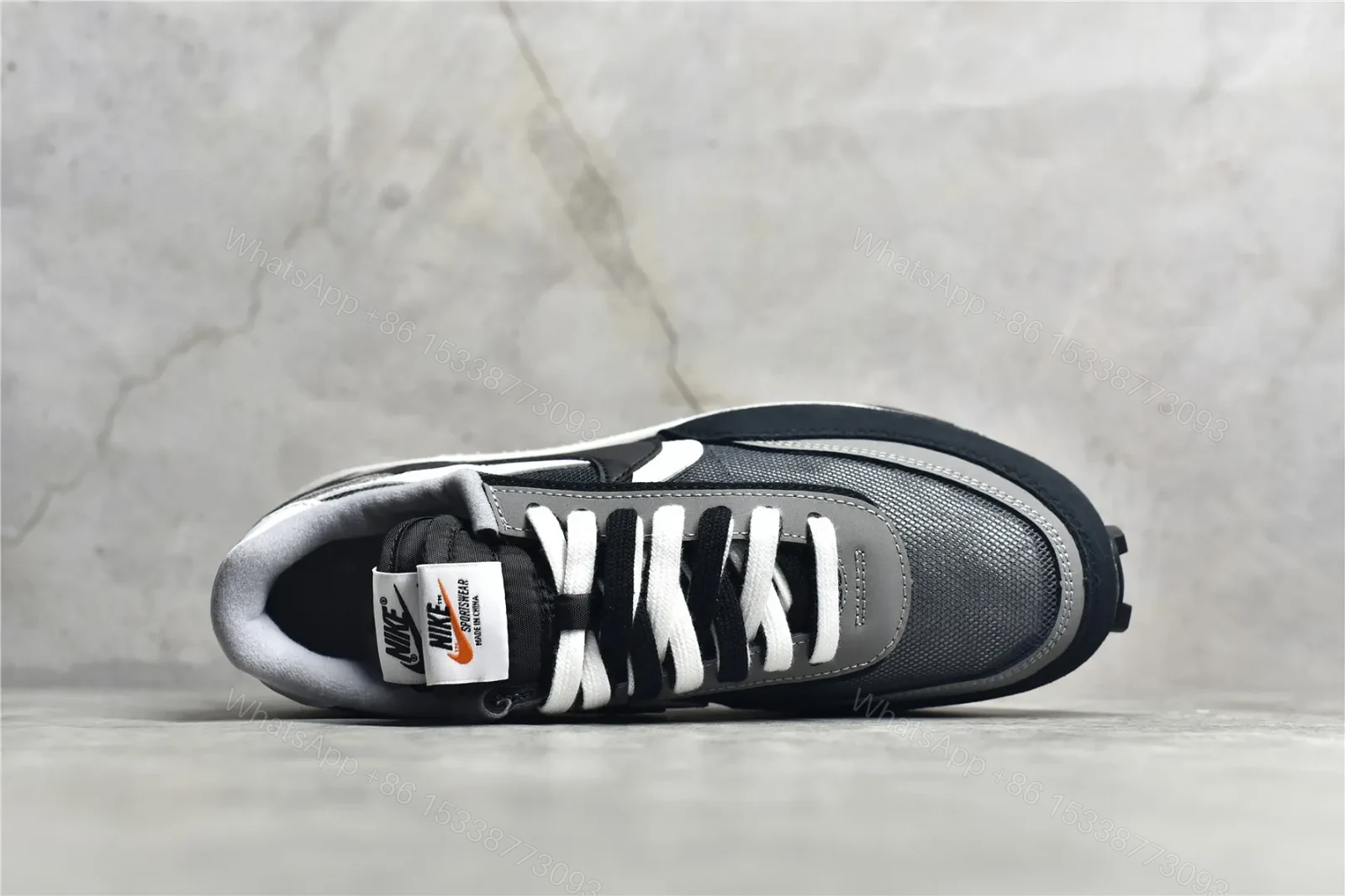 View 6 of Sacai × Nike Waffle Black and White Reps