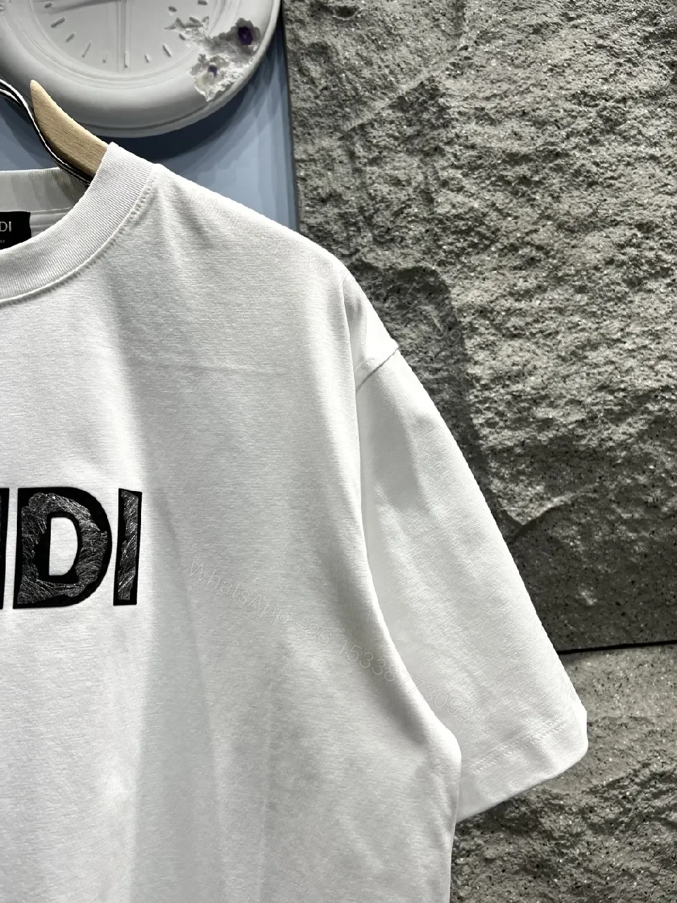 View 9 of White Cotton Logo Tee - Minimalist Luxury, Relaxed Fit, Front Fendi-Inspired Emblem