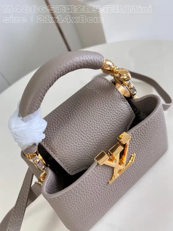 View 9 of Taupe Pebbled Leather Crossbody: Gold LV Accent, Compact Luxury Bag