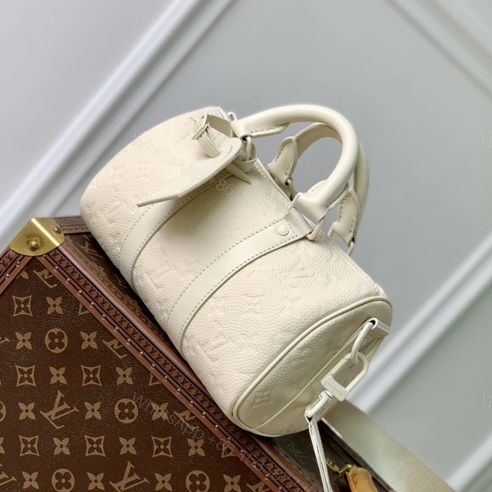 View 3 of Louis Vuitton Keepall Bandoulière 25 Bag Cream 25Cm M24434