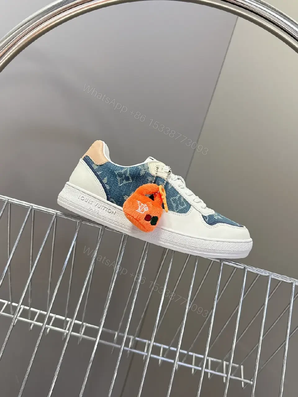 View 2 of Denim-Accent Luxury Sneakers with LV Flair