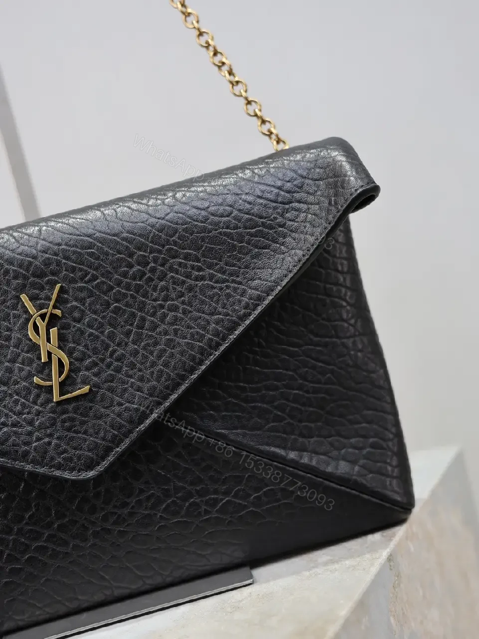 View 3 of Pebbled Leather Envelope Flap Bag, Gold Logo, Day-to-Night Versatility