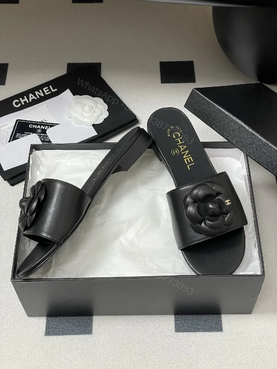 View 4 of Effortless Black Leather Slide with Camellia Detail