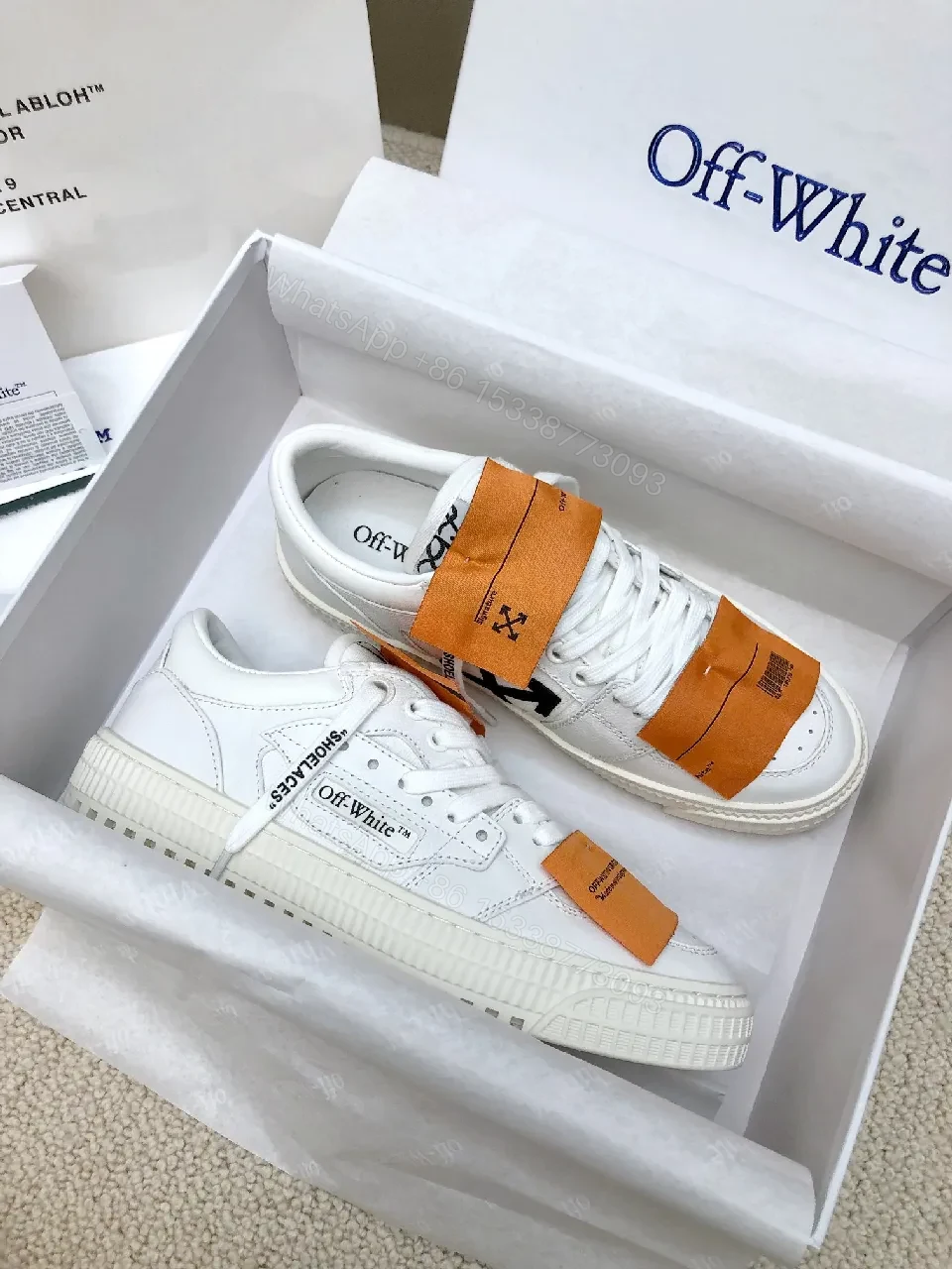 View 3 of White Leather Low-Profile Sneakers with Signature Tape Details