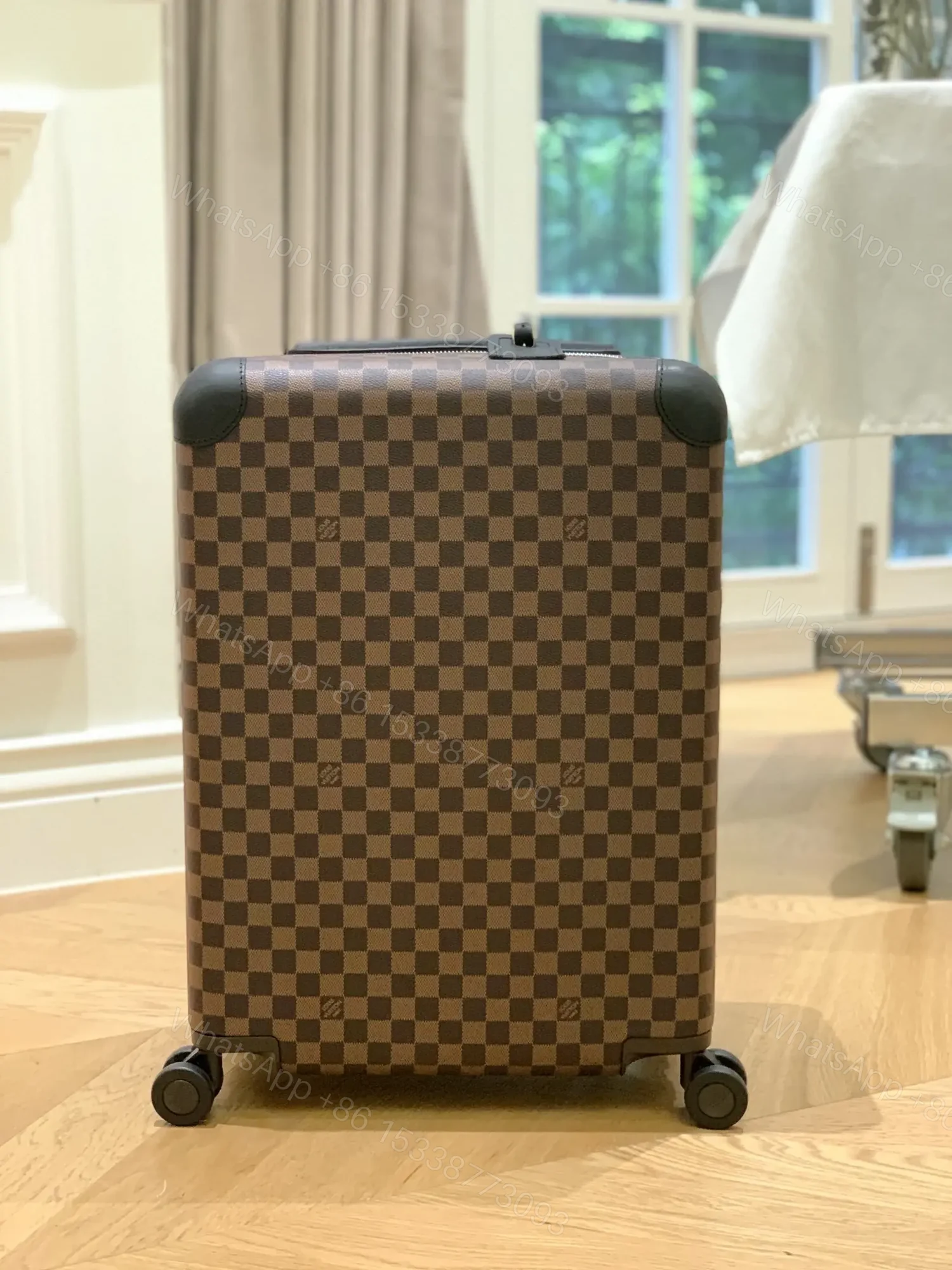 View 2 of Louis Vuitton Horizon 55 rolling suitcase in Damier Ebene canvas.