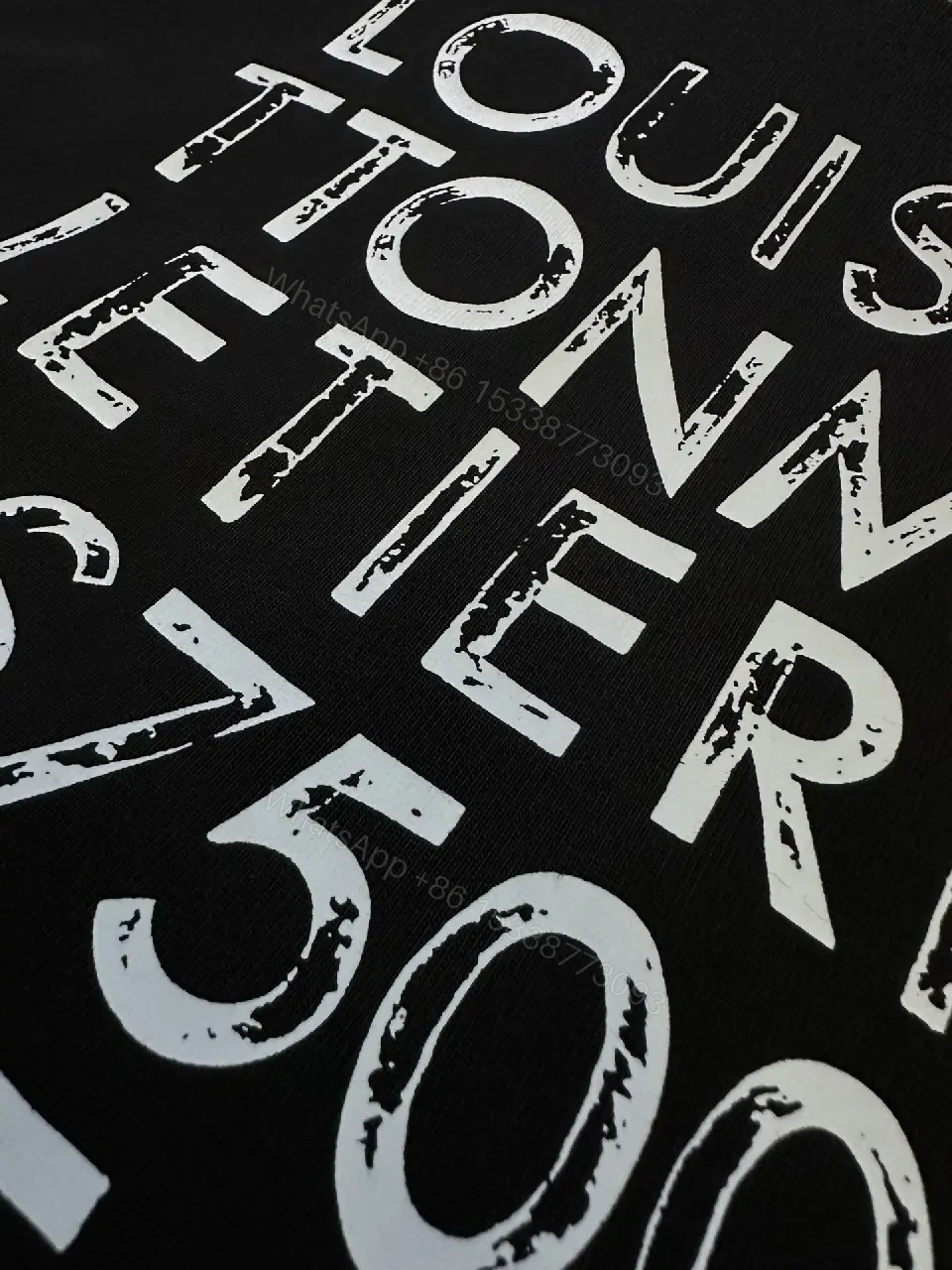 View 7 of Minimalist Black Tee with Subtle LV.M Emblem, Lux Cotton