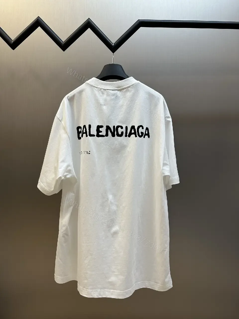 View 7 of Oversized Graphic Tee with Subtle Distress and Logo – Premium Cotton
