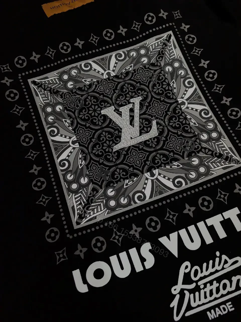 View 5 of Minimalist Black Cotton Tee with Subtle LV Emblem