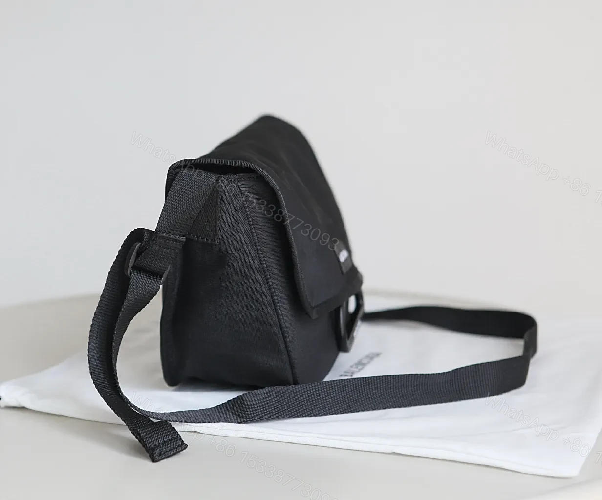 View 6 of Black Durable Matte Nylon Messenger Bag – Compact, Adjustable Strap, Minimalist Style