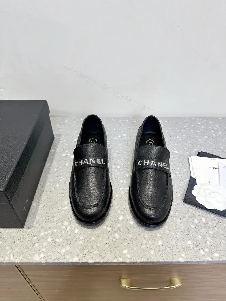 Black Leather Slip-On with Logo Strap – Modern Luxe Comfort — view 1