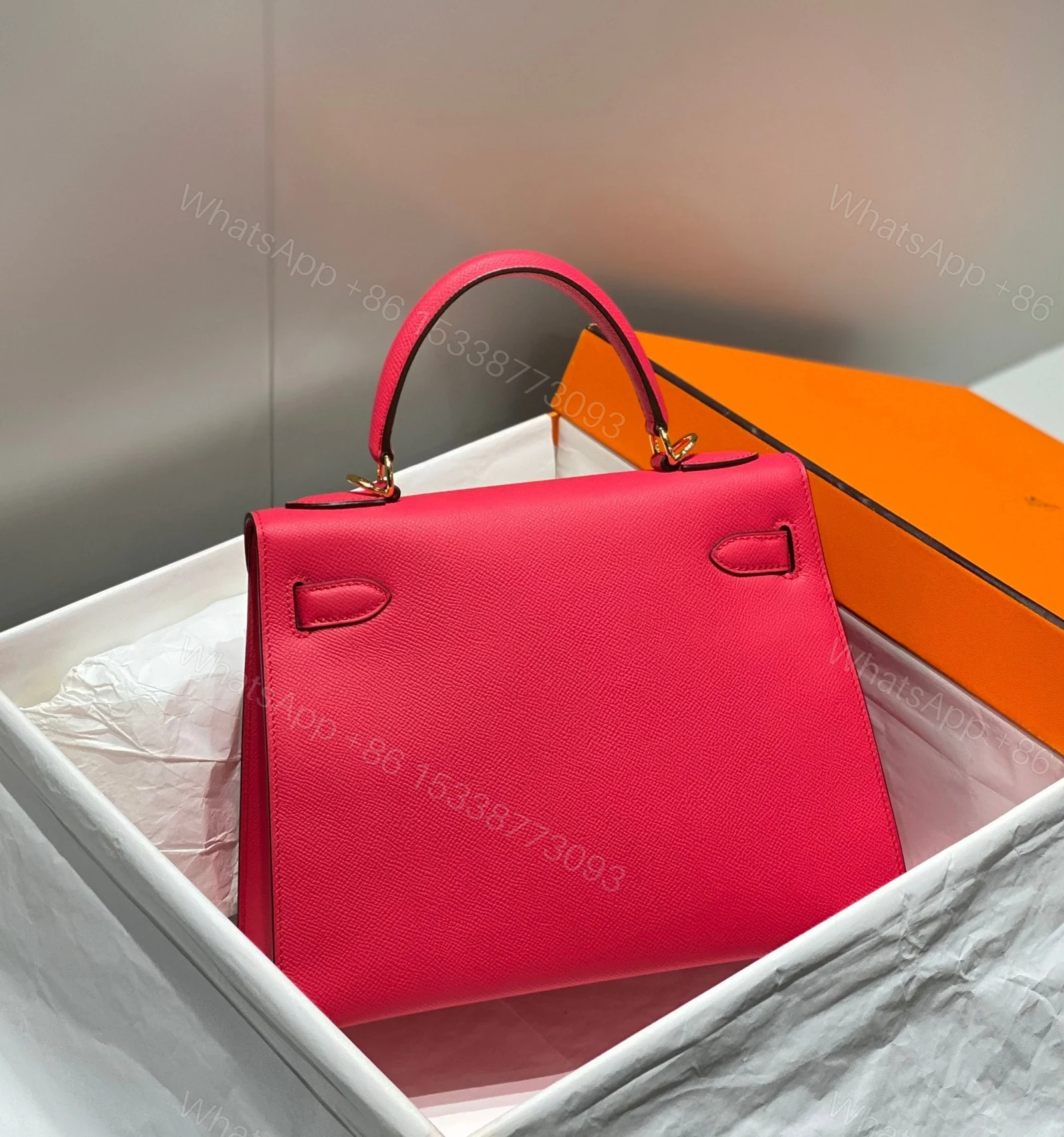 View 4 of KELLY 28CM IN ROSE TYRIEN SWIFT CALFSKIN GOLD HARDWARE