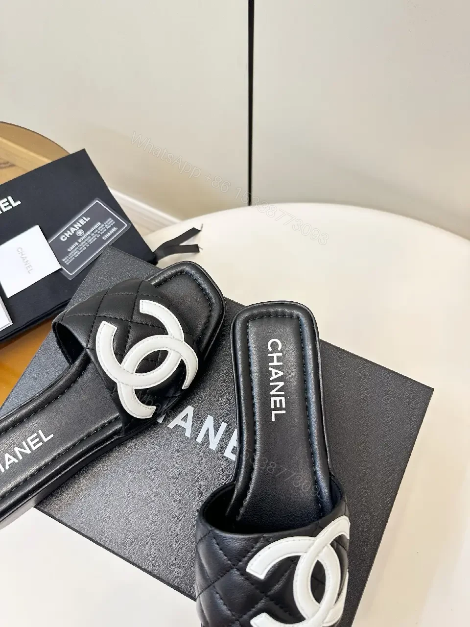 View 3 of Black Quilted Chanel Sliders with White Logo, Slide Sandals