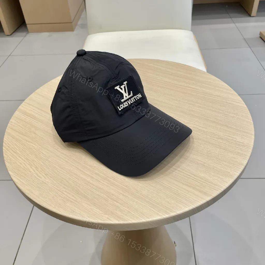 View 2 of Compact Black Cap with Subtle LV Patch, Six-Panel, Adjustable Strap