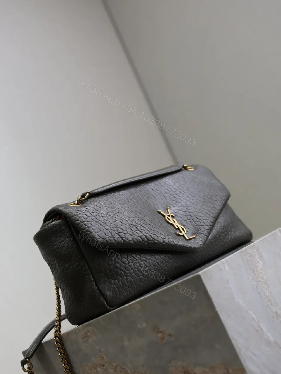 View 8 of Textured Leather Envelope Bag: Black + Gold Accent, Compact Luxury Shoulder Bag