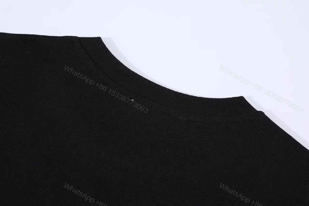View 10 of Black Cotton Minimalist Tee – Subtle Chest Logo, Premium Essential