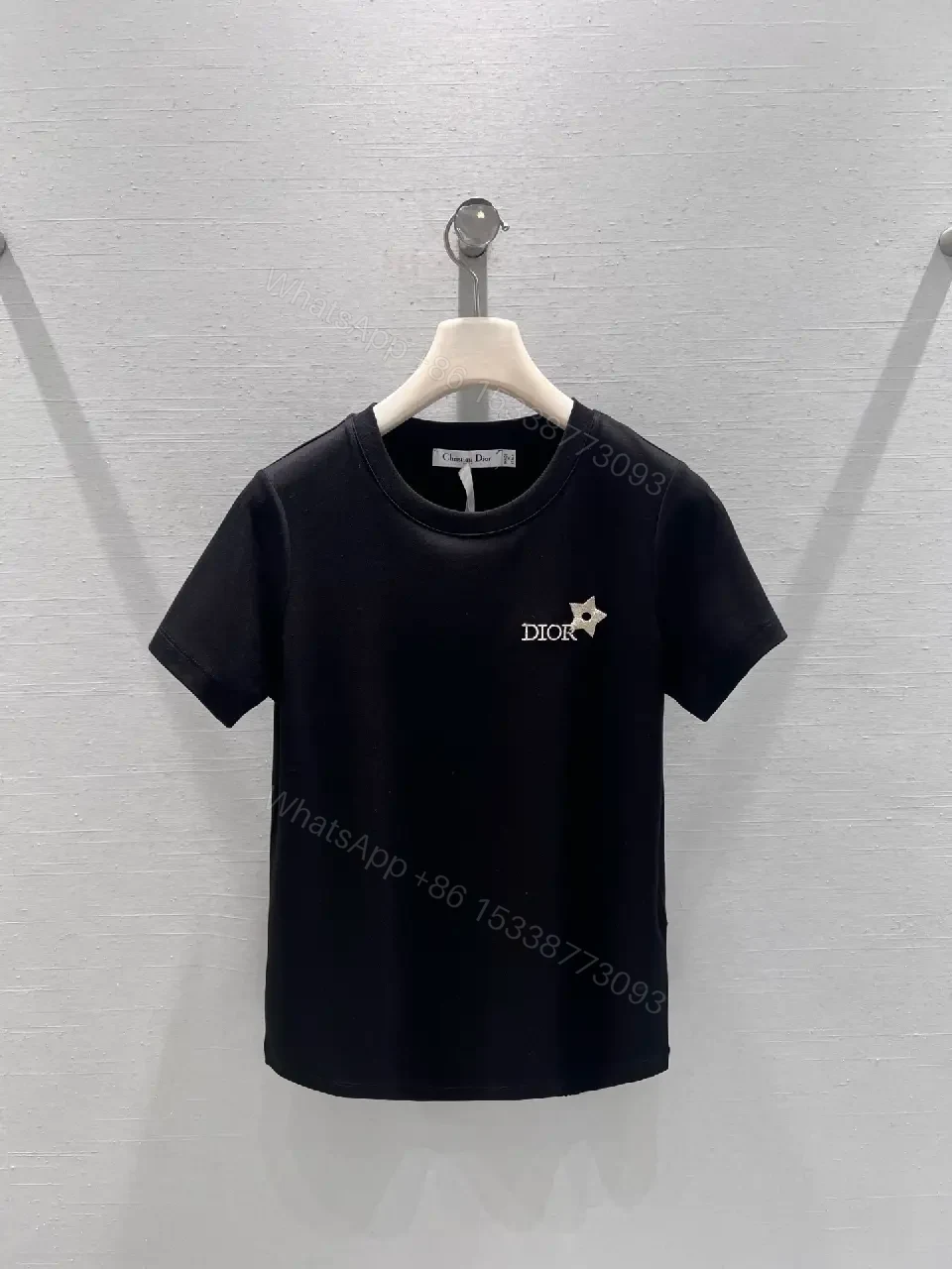 Minimalist Black Cotton Tee with Discreet Emblem — view 1
