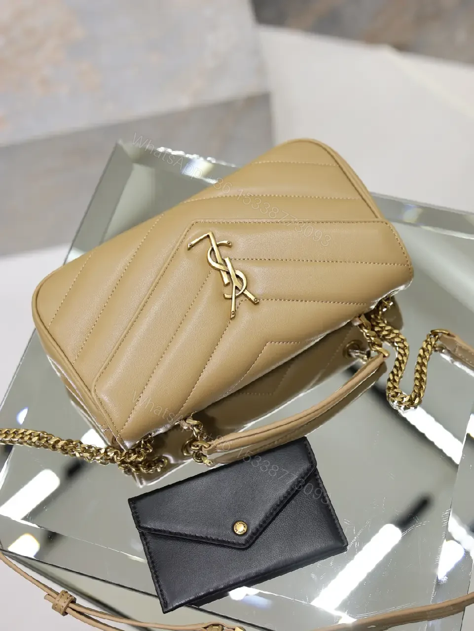 View 2 of Beige Leather Structured Top-Handle Flap Bag with YSL Logo