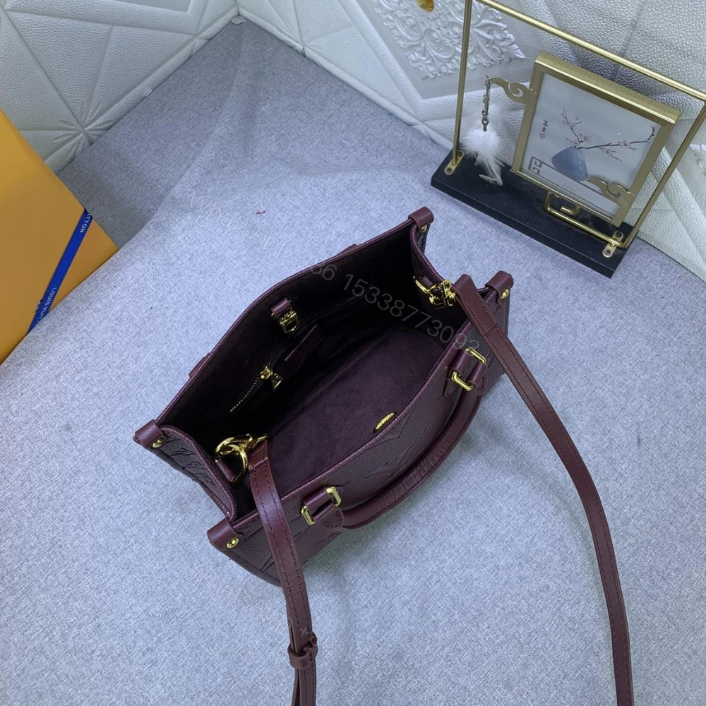 View 7 of Louis Vuitton Onthego MM Monogram Empreinte Wine Red 35Cm M46601