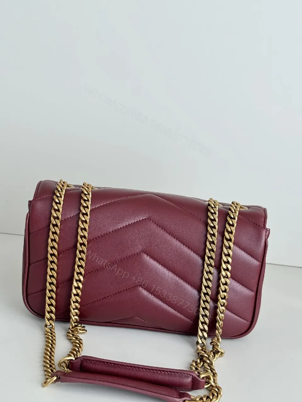 View 3 of Burgundy Quilted Satchel with Gold Chain Detail