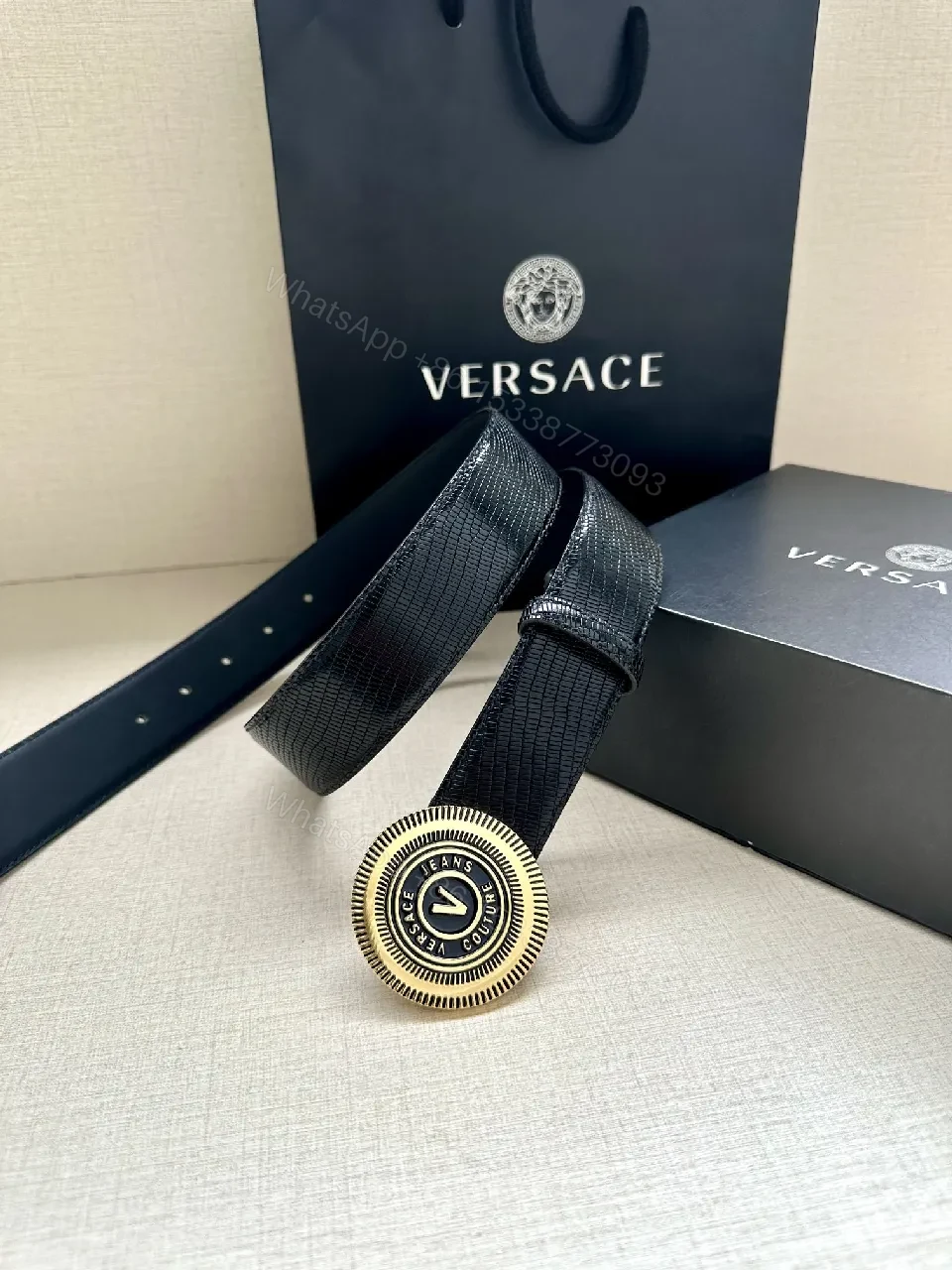 View 8 of Textured Leather Belt with Round Emblem Buckle – Luxe Minimalist Style
